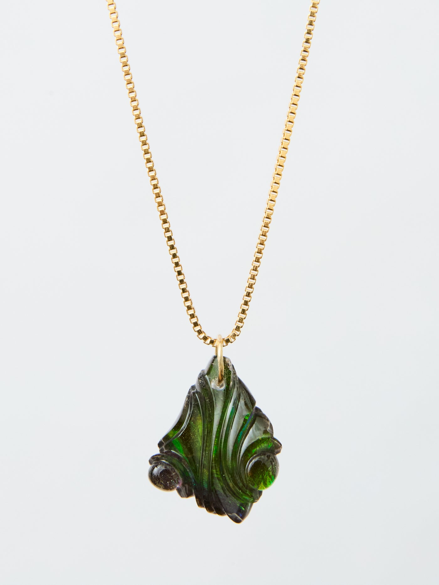 Carved Ammolite Pendant